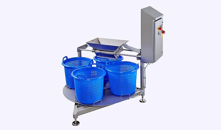 Carrousel à paniers automatisé KAB à quatre paniers – remplissage de paniers par ex. en aval des laveurs GEWA Plus ou HEWA
